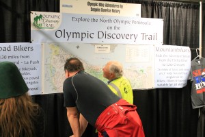Checking out Olympic Discovery Trail maps at Seattle Bike Expo