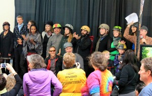 Local bike travel author Willie Weir, at extreme right, presents bike advocates at fashion show