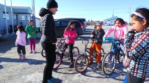 Clara Hughes talks with young cyclists