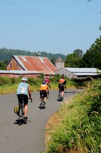 Tour de Peak cyclists pass barns and outbuildings